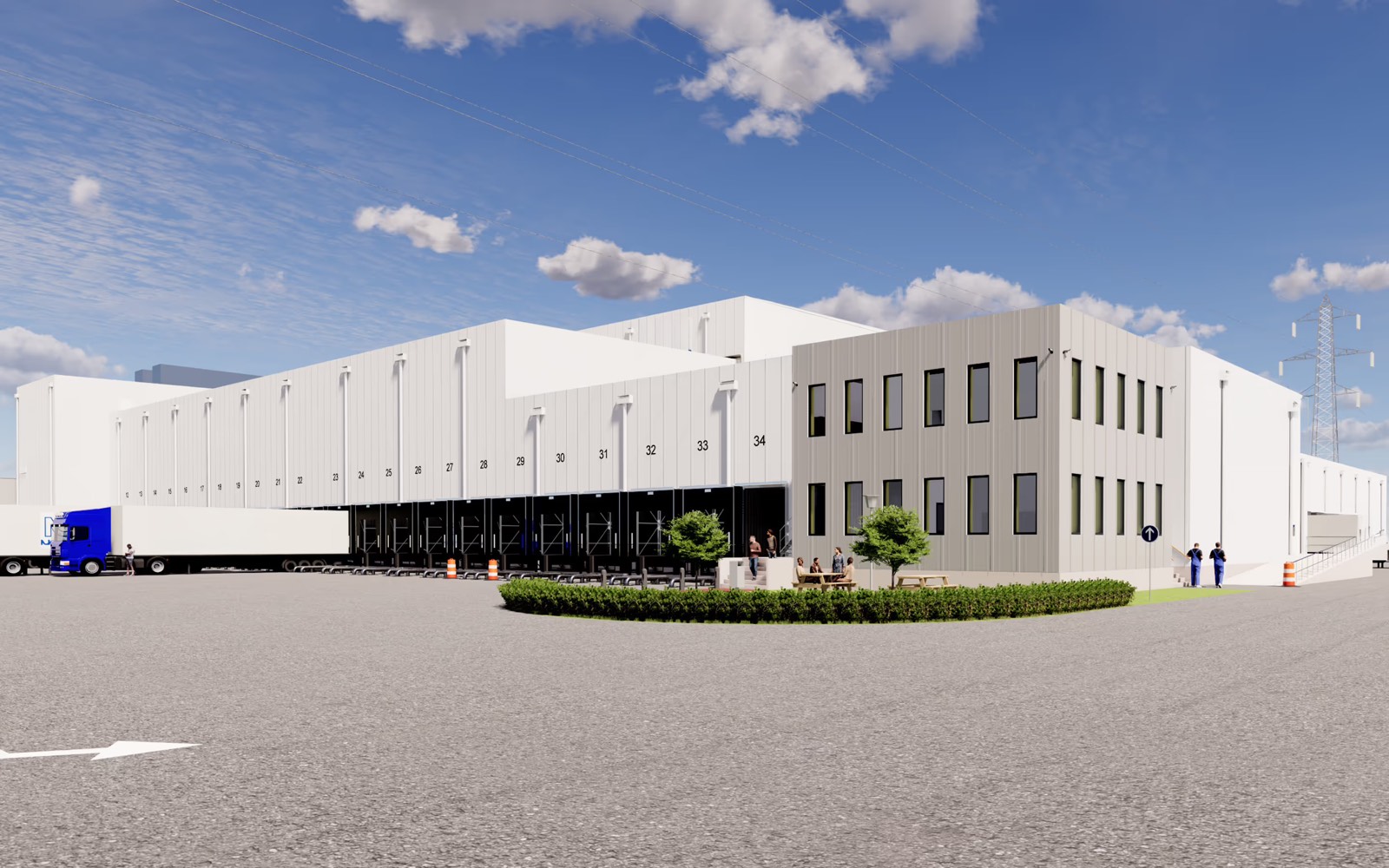 Cold store with a long run of numbered dock doors and an adjoining two-storey office block