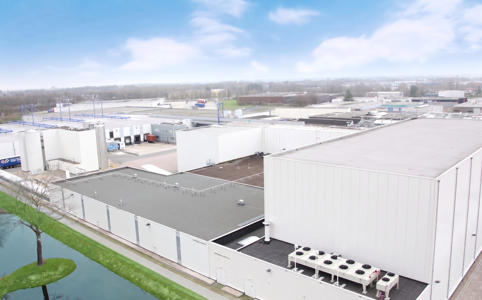 Cold store from the air, condenser units ranked on the roof and a canal along the front